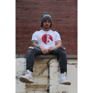 Male model wearing Mikan Geisha shirt sitting on wall wearing a beanie in shirt size large